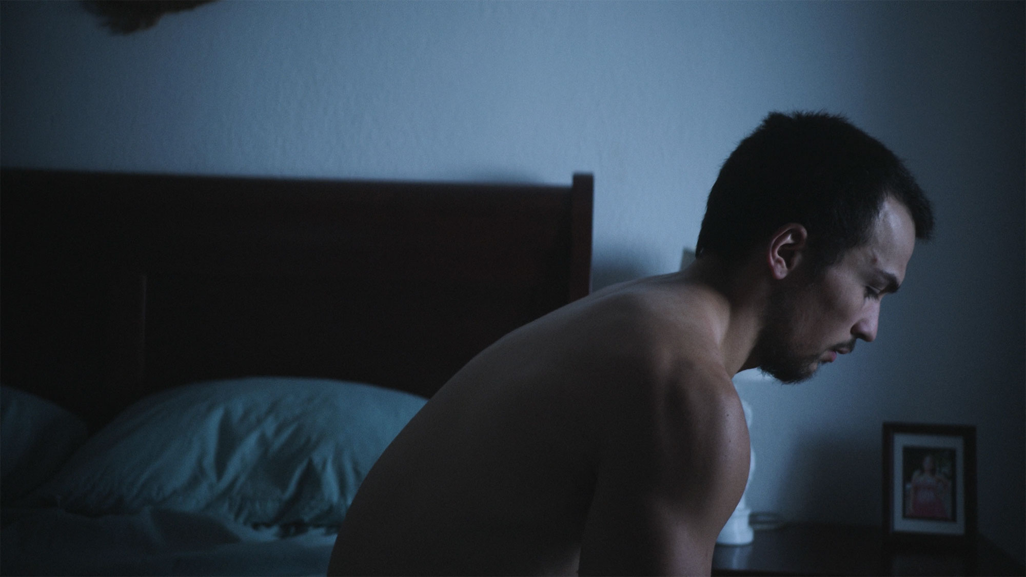 CrossFit Athlete Sitting On Bed